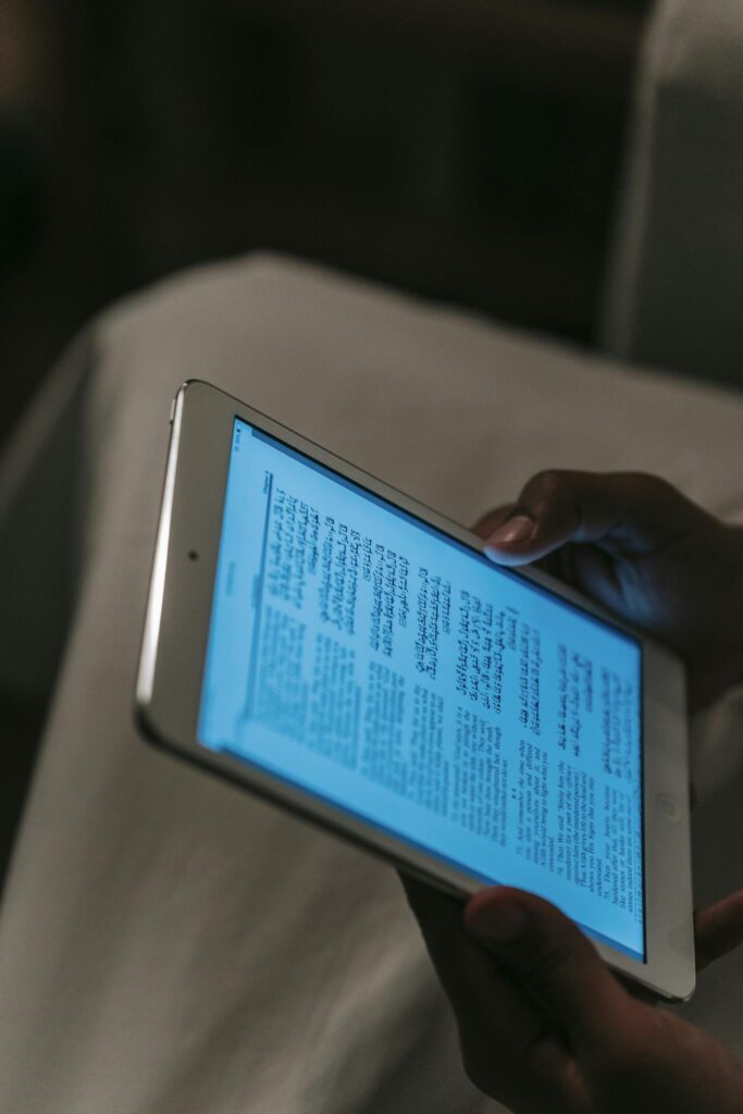 Person using tablet in dark room